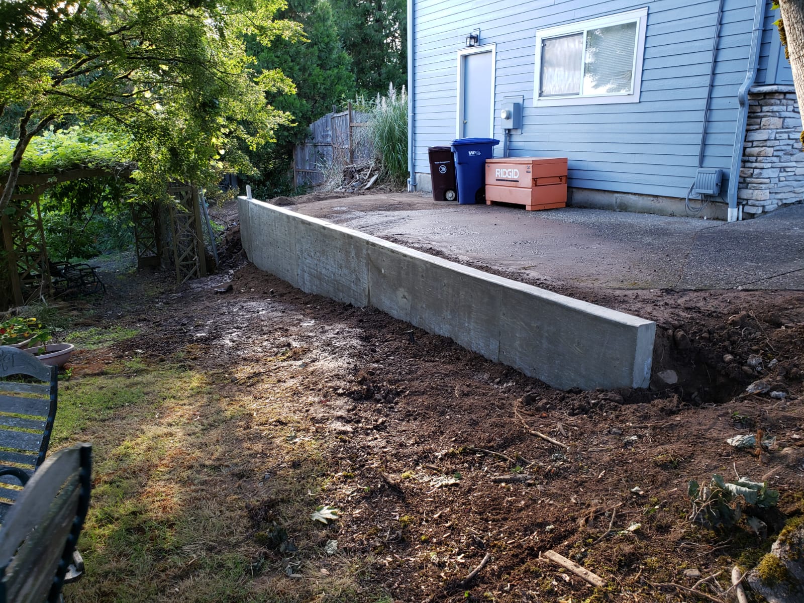 What are some ways to enhance your surroundings with concrete retaining walls?